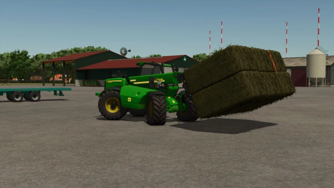 FS25 Pallet Fork v1.0.0.0 mod lifting hay bale with green tractor.