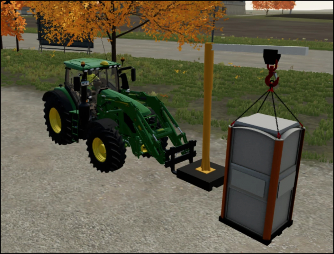 FS22 mod Portable Jib Crane v1.0.0.0 lifting a portable toilet using a green tractor in Farming Simulator 22.