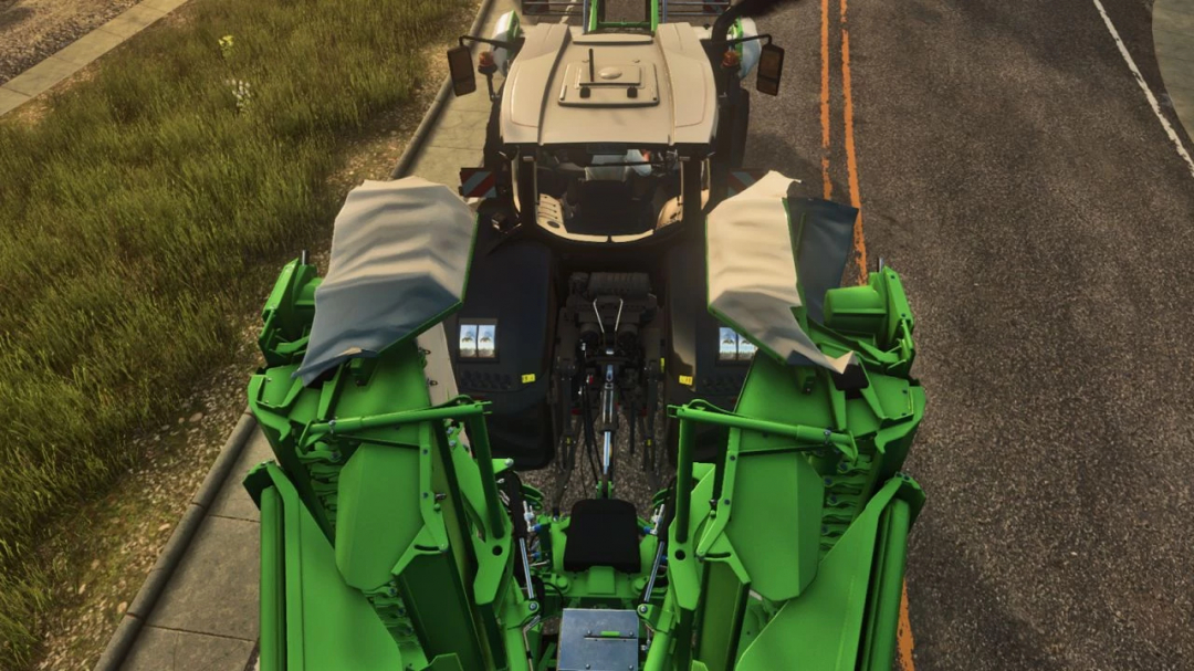 A tractor with a green attachment using the Realistic 3 Point Attacher mod in Farming Simulator 25.