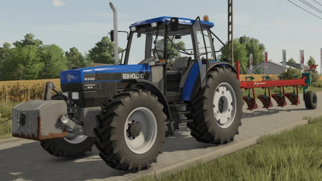 FS22 mod Rust Texture Pack v1.0.0.0 featuring a New Holland tractor with rust details on a farm path in Farming Simulator 22.