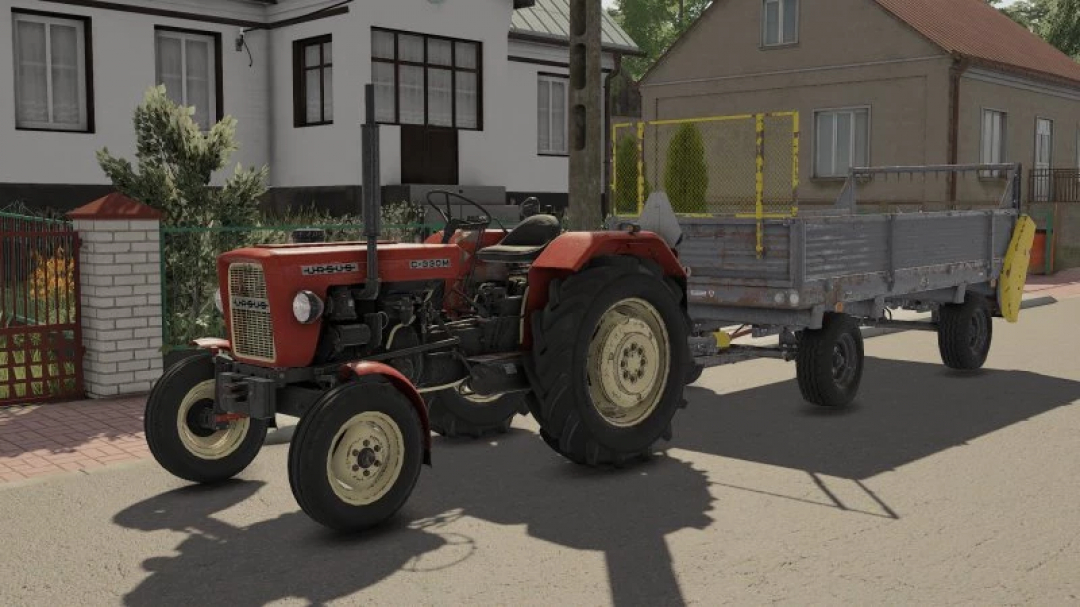 FS22 mods Rust Texture Pack v1.0.0.0 shows tractor with rusty trailer in a residential area, enhancing the realism in Farming Simulator 22.