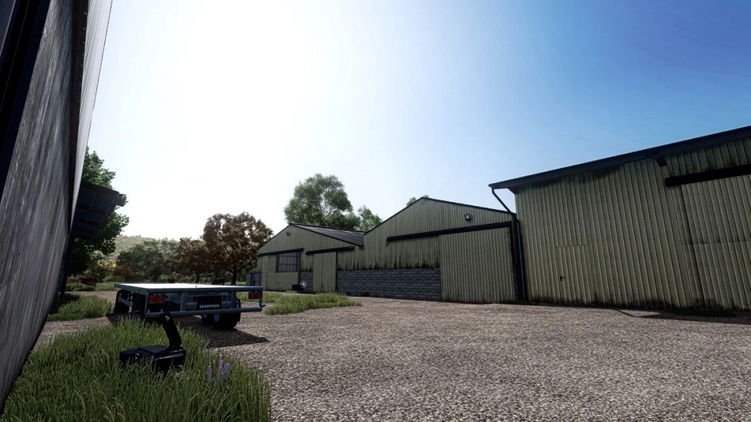 Shader MKSHV1 mod for FS25 showcasing realistic lighting on farm buildings.