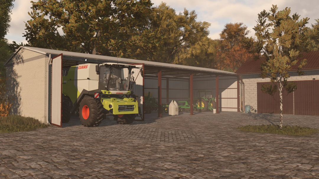 FS25 mod Shed With Garage v1.0.0.0 showing a parking area with farming equipment, including a tractor and harvester.