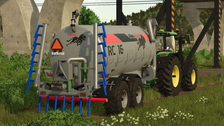 fs25-mods,  FS25 mod JA&MA Reboal RC-16 v1.0.0.0 featuring a detailed slurry tank attached to a tractor in a grassy field.