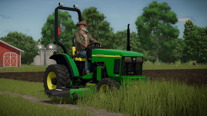 fs25-mods,  FS25 mod showing John Deere 4100 Compact Tractor in a farm setting with a red barn and silos.