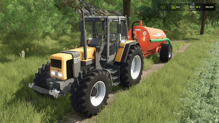 fs25-mods,  Renault TZ tractor mod in FS25 pulling an orange tank trailer on a grassy path.