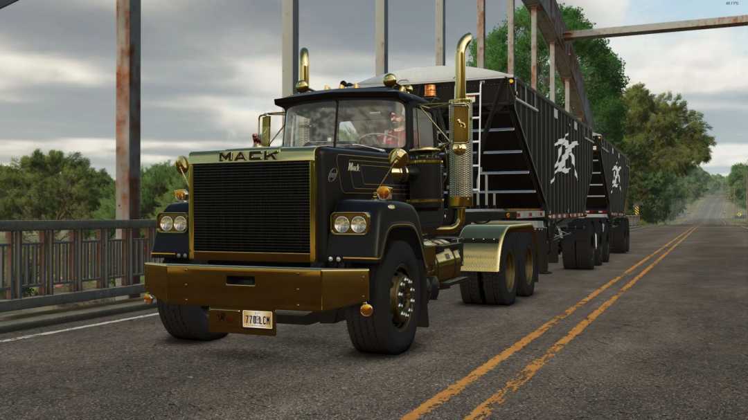 1979 Superliner truck mod in FS25, black and gold design, on a bridge.