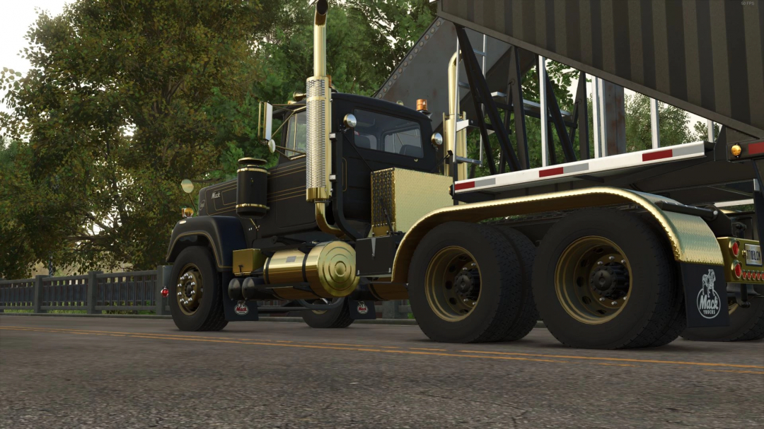 1979 Superliner Edit mod for FS25, showcasing a vintage black and gold truck with detailed design, set against a lush green background.