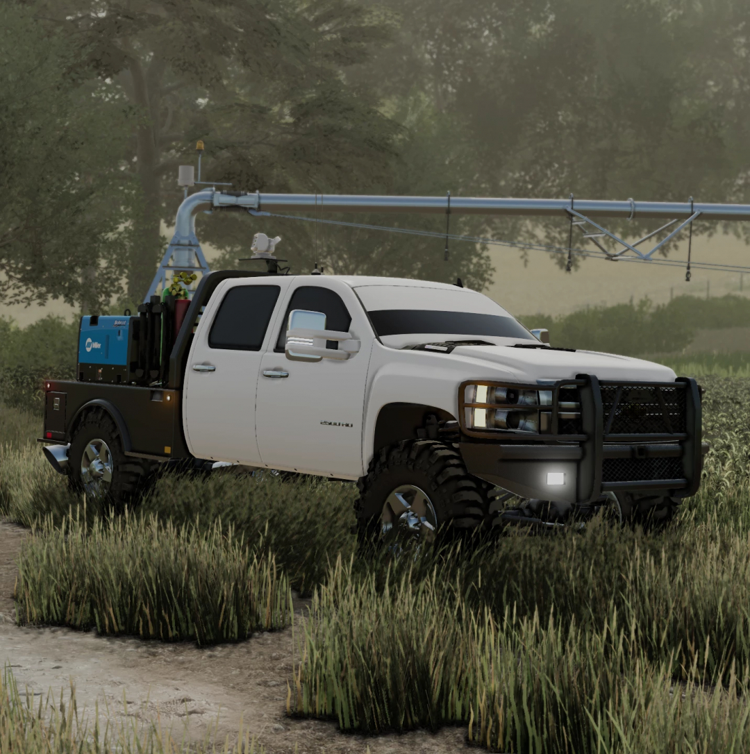 2010 Duramax 2500 mod for Farming Simulator 22 parked in a field with tools in the truck bed.