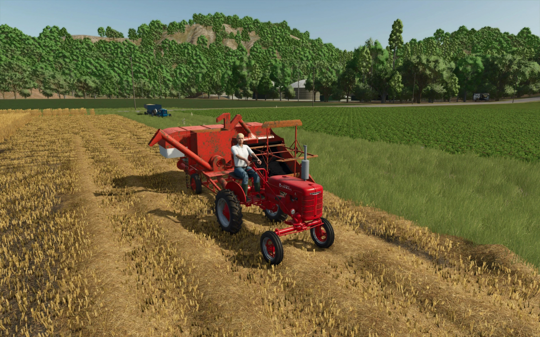 Red tractor with Allis Chalmers All-Crop 60 in FS25 mod on a harvested field.