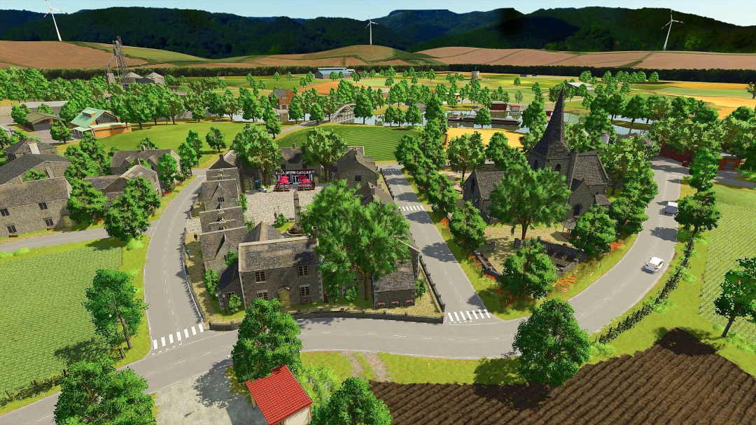 Scenic village landscape in FS25 mod Au Fil des Saisons v1.1.0.0, featuring roads, houses, trees, and fields.