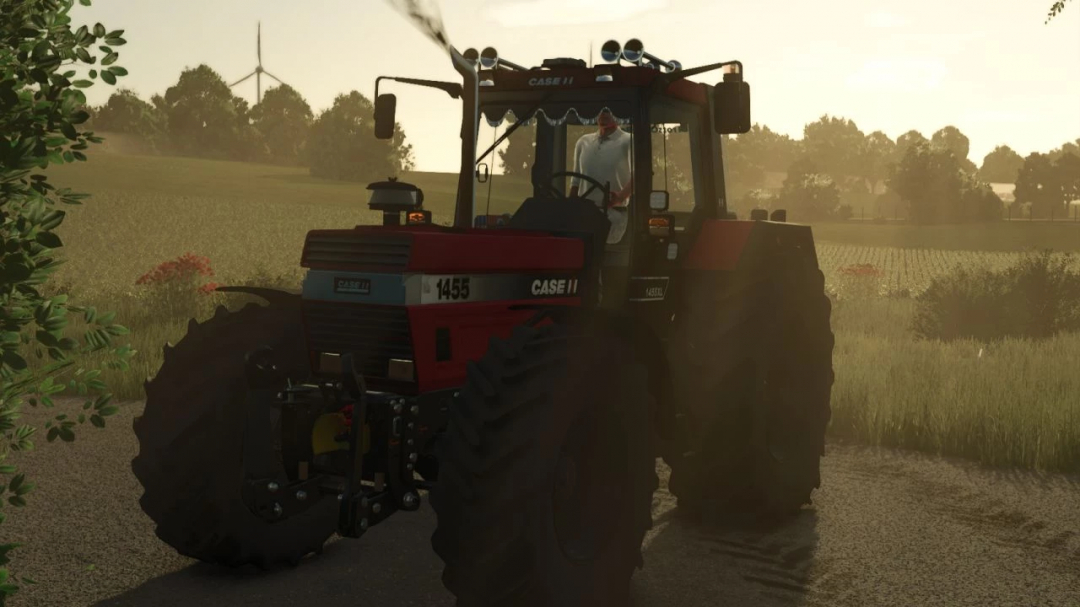 Case IH 1455XL tractor mod in FS25, driving on a countryside road at sunset.