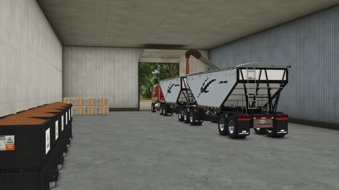 FS25 mod Crop Inputs Co-operative v1.0.0.0, showcasing a grain trailer inside a storage facility.