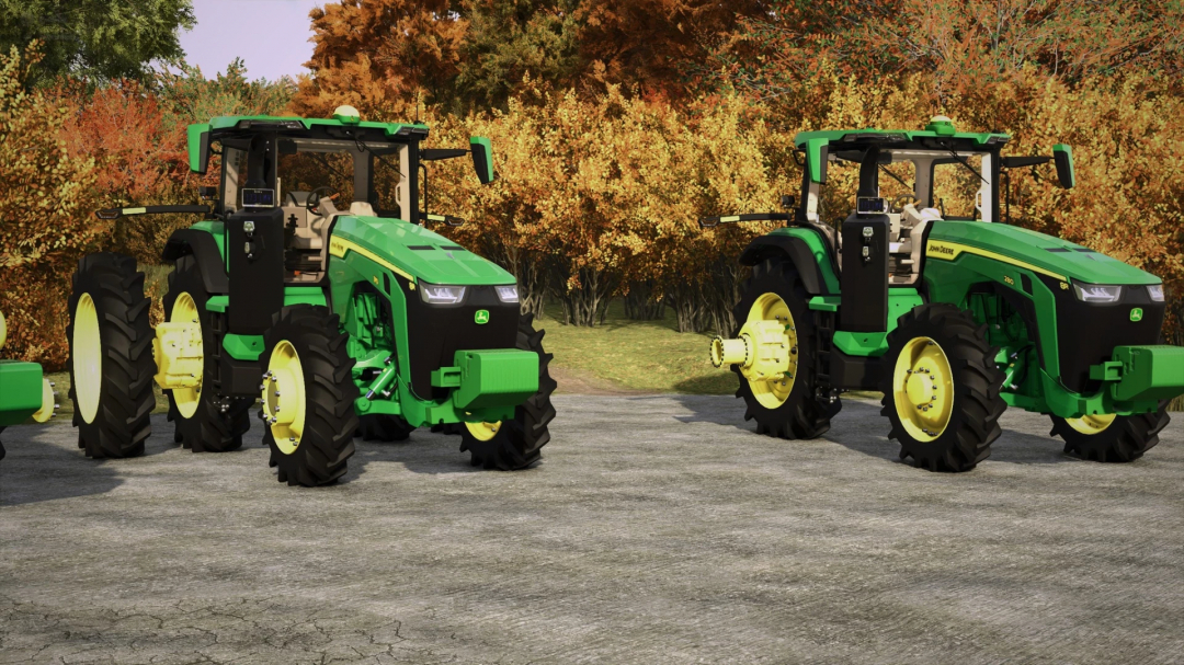 Two John Deere 8R tractors in FS25 mod, featuring green and yellow design with autumn foliage backdrop.