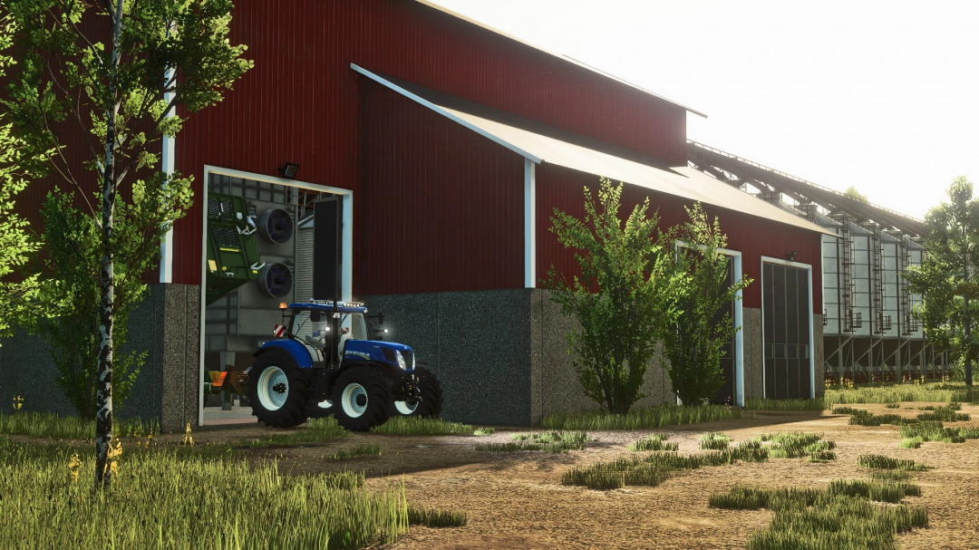 FS25 mod Grain silo v1.0.0.0, showing a blue tractor by a large red barn in Farming Simulator 25.