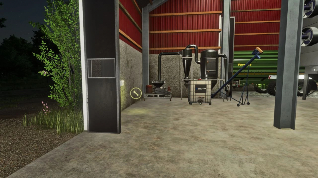 Interior of a barn in FS25 with grain silo mod version 1.0.0.0, showing equipment and machinery.