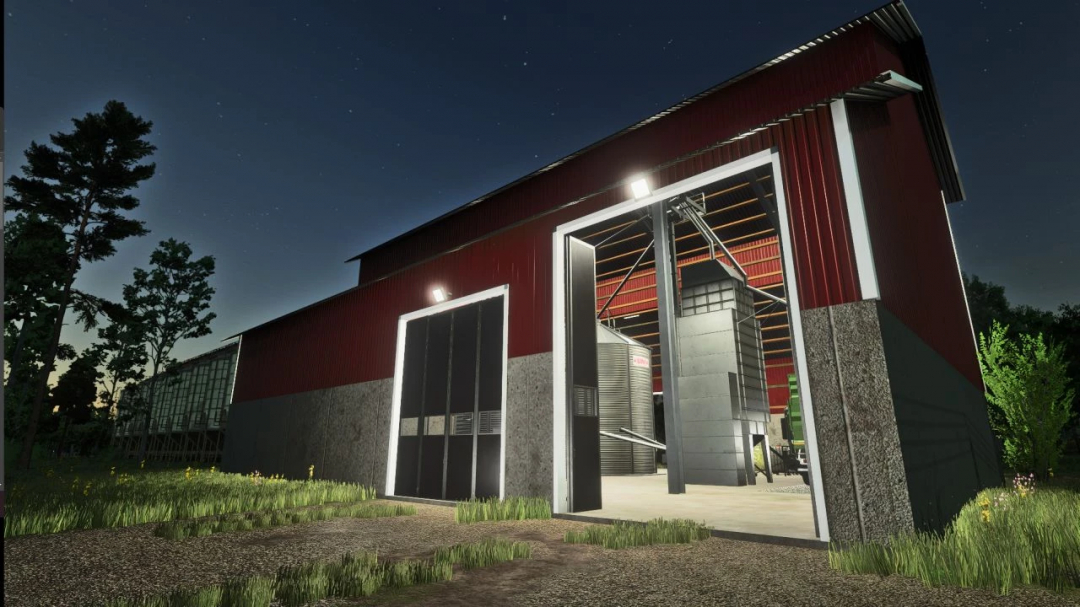 Grain silo mod in FS25, night view of an illuminated metal structure and barn.