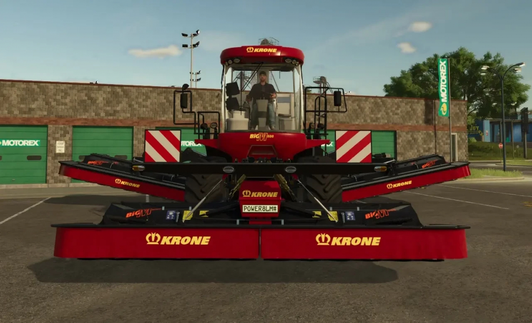 FS25 mod: Krone Big M 500 v1.1.0.0 displayed in a parking area.