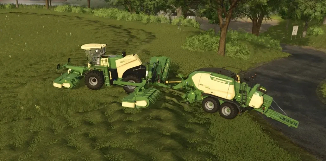 Krone Big M 500 mod in Farming Simulator 25 mowing a grassy field. FS25 mods enhance farming vehicles.