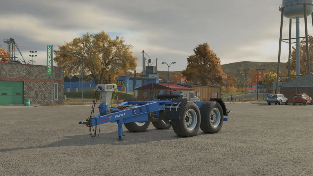 MEGA Mario 2 Dolly mod for FS25 in a parking lot, showcasing a blue dolly trailer with scenic autumn background.