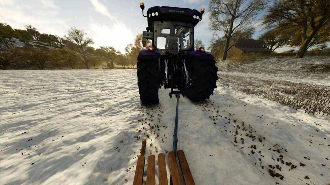 Tractor pulling a sledge over a snowy field in FS25 mod Sledge v1.0.0.0, showcasing winter farming simulation.