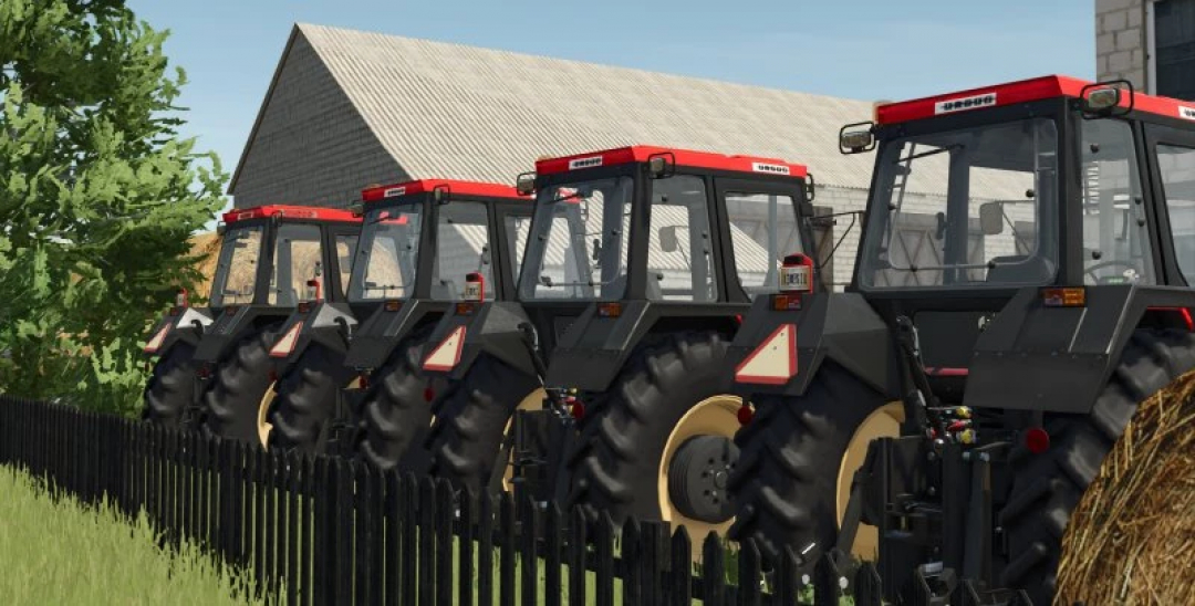 Line of URSUS tractors from FS25 URSUS PACK 1234-1734 mod next to a barn.