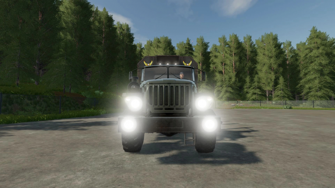 Ural 4320 Timber Truck mod in FS22, headlights on, set against a forest backdrop.