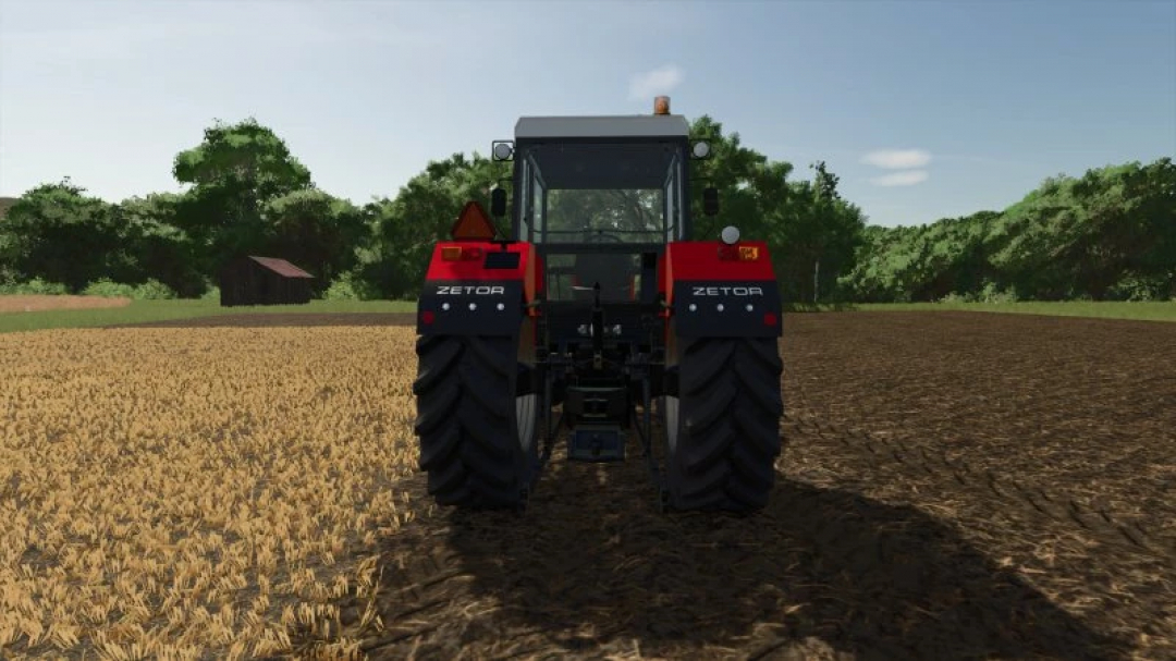 Zts 16245 tractor mod in FS25 on a farm field, rear view.