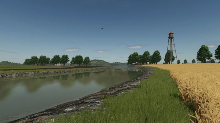 fs25-mods,  FS25 mod A Long The River Farm v1.0.0.0 features a serene river landscape with a water tower and surrounding wheat fields.