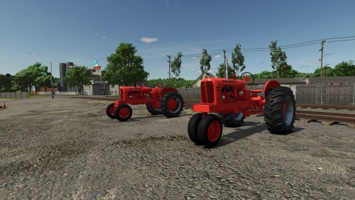 fs25-mods,  Two Allis Chalmers WD45 tractors showcased in FS25 mod, set in a rural industrial landscape.