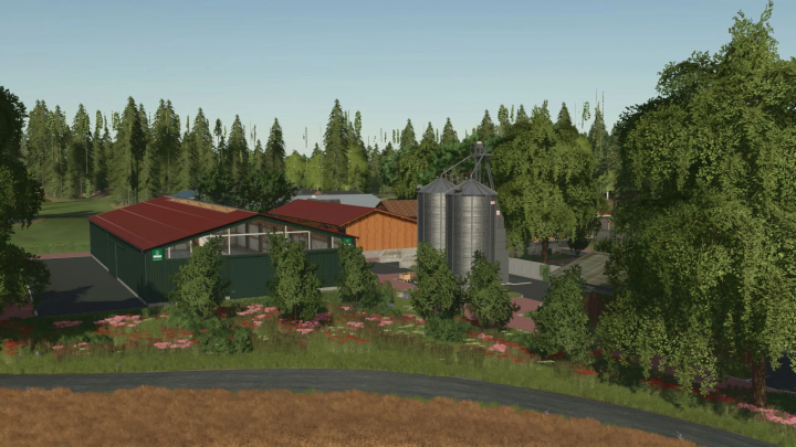 fs25-mods,  Garbindel Map v1.0.0.1 in FS25 showcasing farm buildings and silos amidst lush greenery.