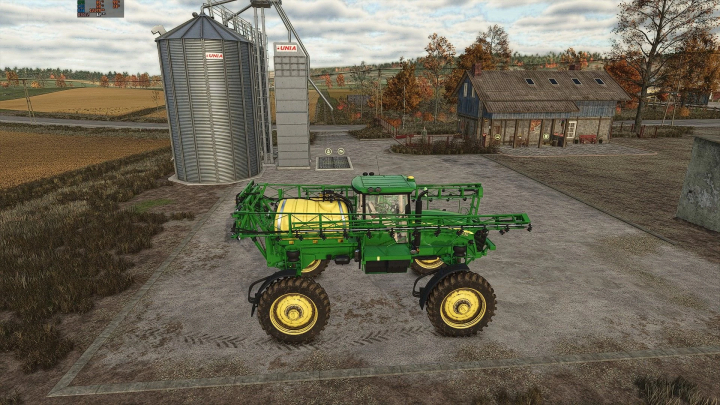 fs25-mods,  FS25 mod: John Deere 4730 sprayer near silos in Farming Simulator 25.