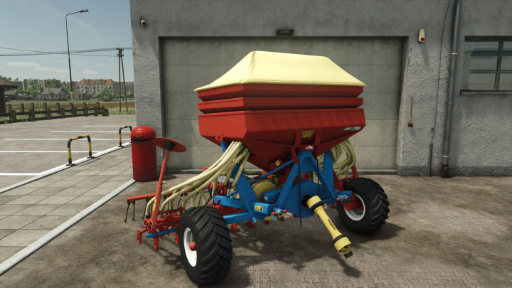 fs25-mods,  Kverneland seeder mod for Farming Simulator 25, showcasing red and blue machinery outside a workshop.