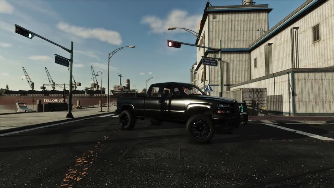 2001 Chevy Silverado mod in FS25, showcased on a city street in Farming Simulator 25.