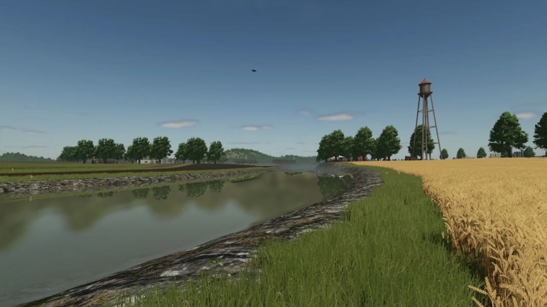 FS25 mod A Long The River Farm v1.0.0.0 features a serene river landscape with a water tower and surrounding wheat fields.