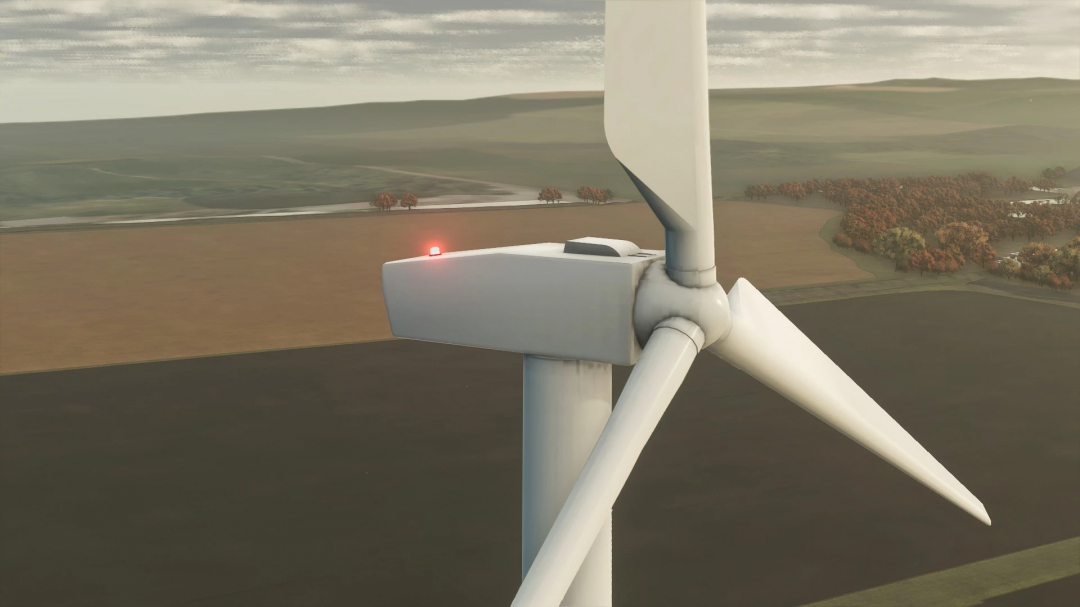 Close-up of an American Wind Tower mod in FS25, set against a rural landscape.