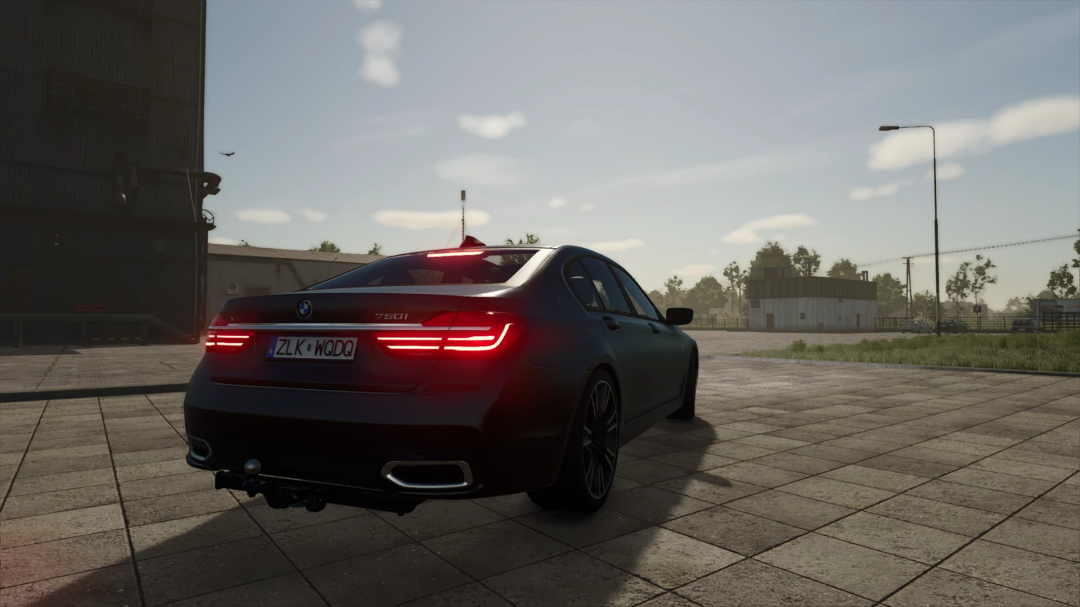 Rear view of BMW 7 Series mod in Farming Simulator 25, showcasing a sleek design and countryside setting.