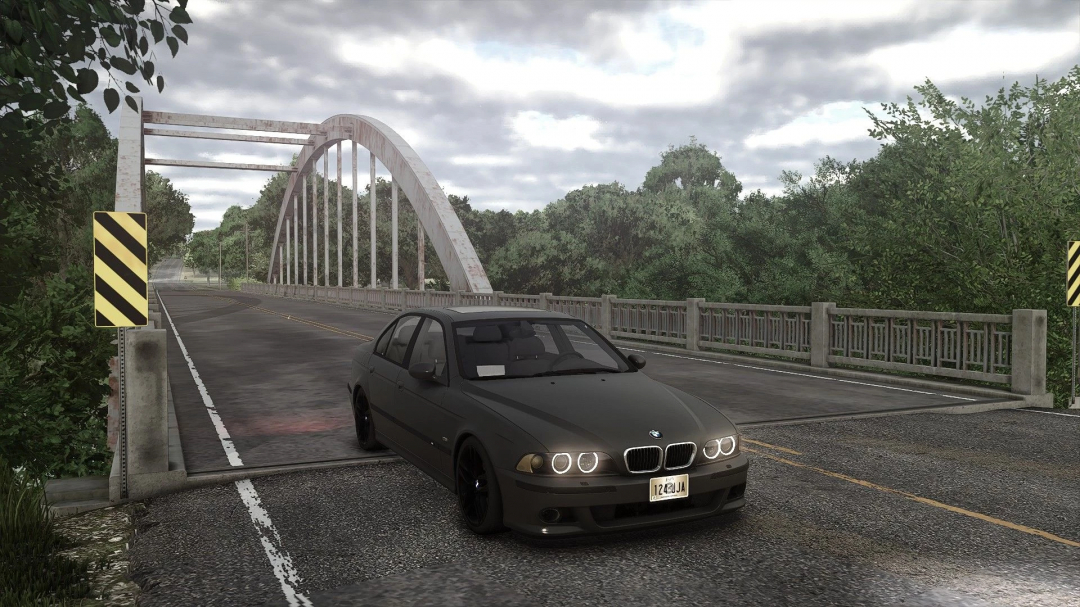 BMW E39 mod for FS25 on a bridge with lush greenery. Farming Simulator 25 mods offer diverse gameplay enhancements.