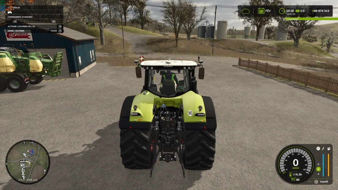 Rear view of CLAAS Axion 900 tractor mod in Farming Simulator 25, parked near a building with farm scenery.