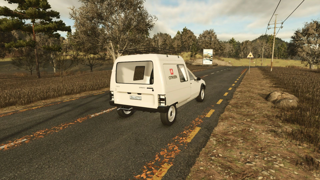 Citroen C15 mod on a countryside road in FS25, showcasing detailed vehicle design and rural scenery.