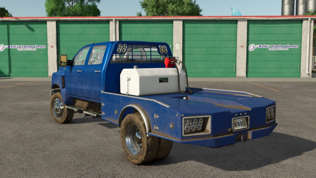 FS25 International CV Series mod v1.0.0.0 features a blue utility truck parked in front of a tractor equipment center in Farming Simulator 25.