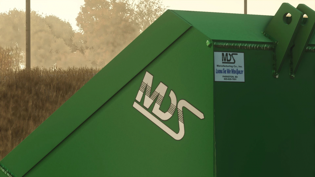 FS25 MDS Bucket v1.0.0.0 mod for Farming Simulator 25. Green bucket with MDS logo in a countryside setting.