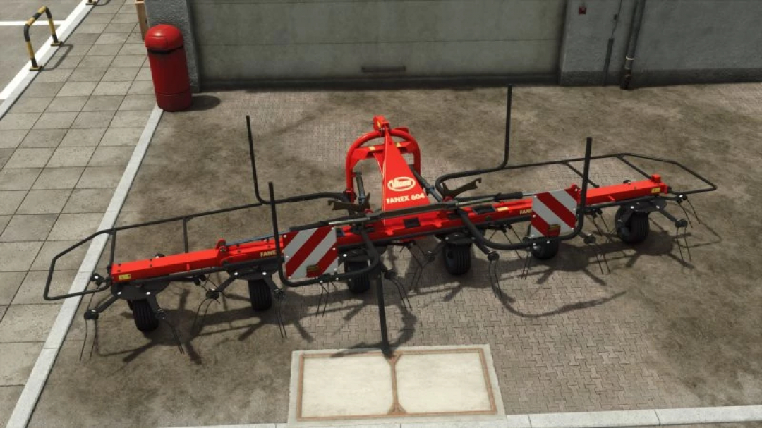 FS25 Vicon Fanex 604 mod showcasing a red agricultural implement on an urban surface. Perfect mod for Farming Simulator 25.