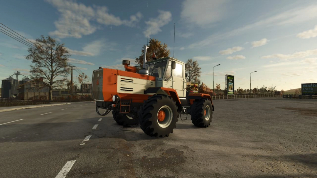 HTZ T 150K V8 tractor mod in FS25, parked on a rural road with a blue sky background.