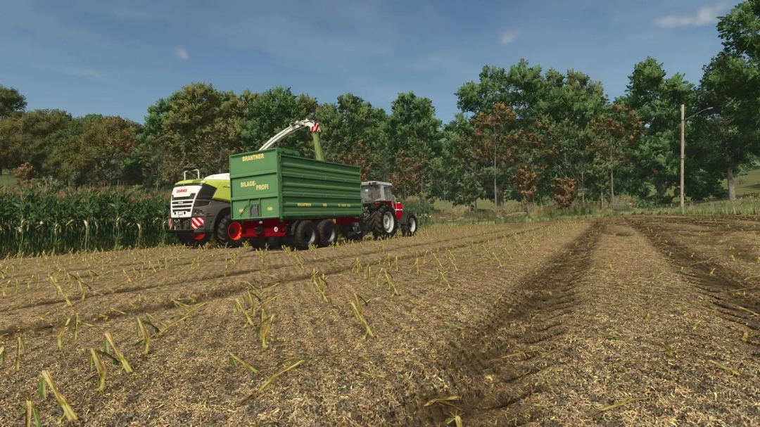 FS25 mod showing improved corn texture with harvesting machinery in a field.