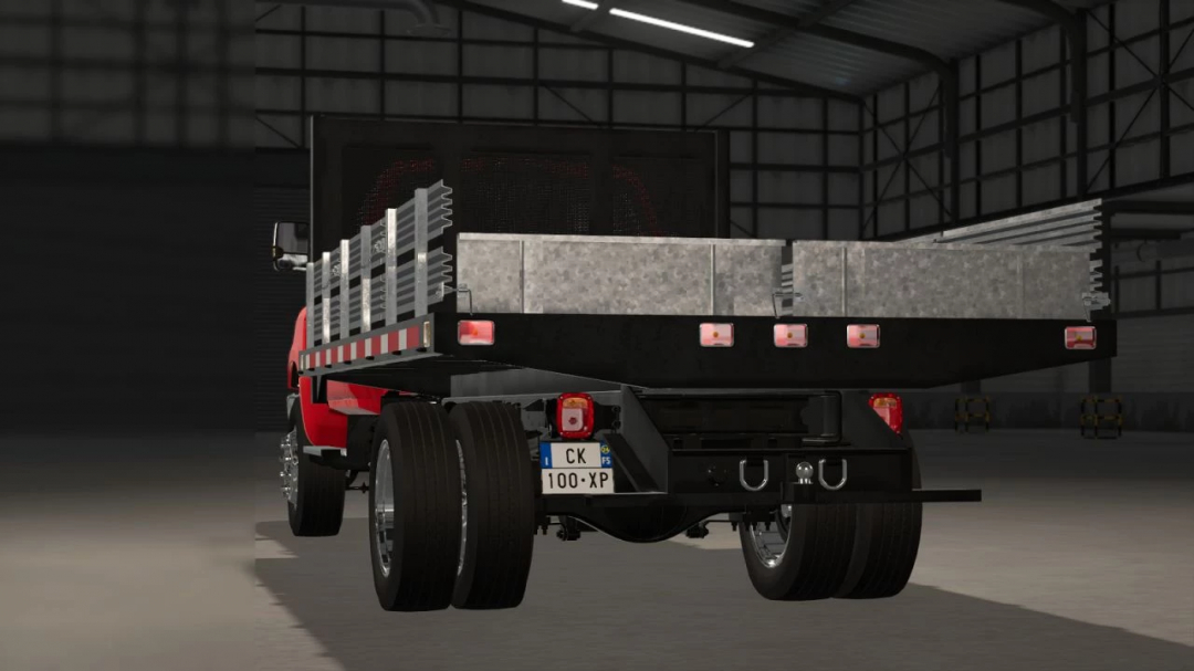 FS25 mod Italian License Plates v1.0.0.1 on a truck in a garage.