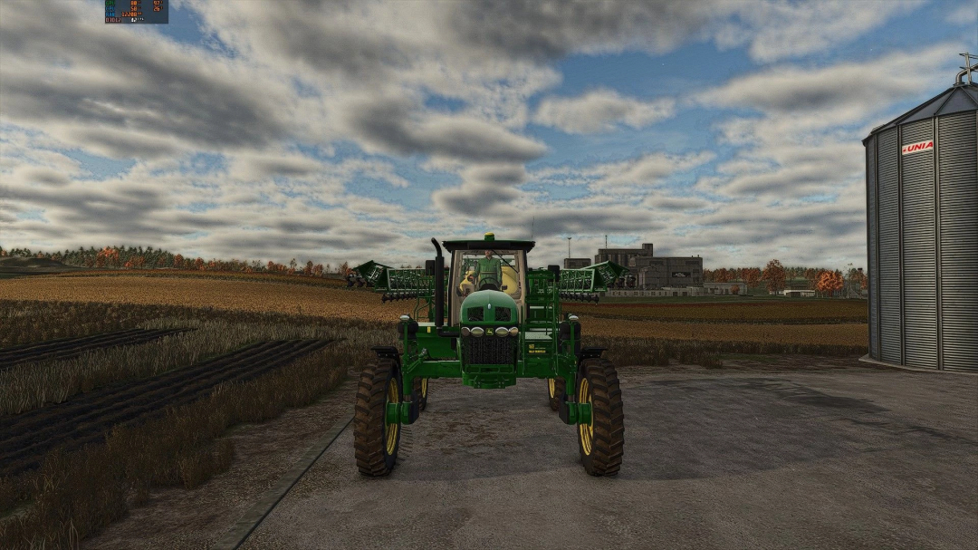 John Deere 4730 mod in FS25, showcasing a green tractor in a virtual farm setting.