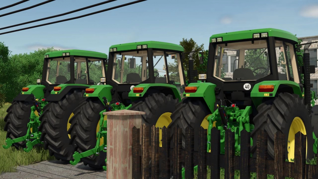 Three John Deere 6000 Series tractors featured in FS25 mod, parked side by side.