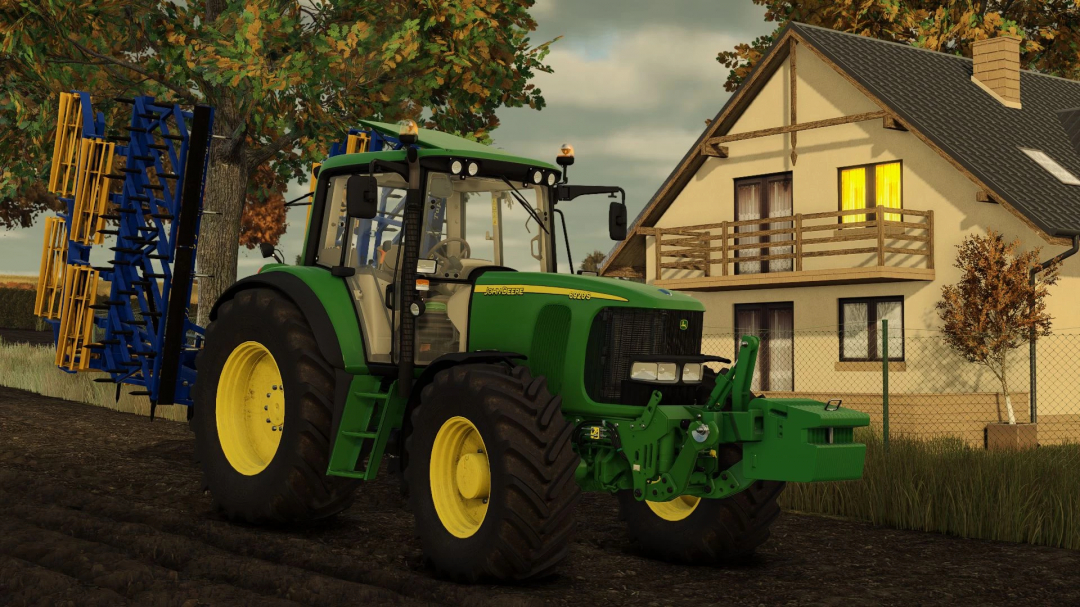 John Deere 6x20 Series tractor mod in FS25 near a house with fall trees in the background.