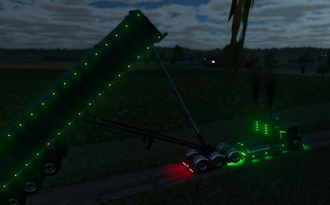 Lizard frameless end dump V2 mod in FS25 with vibrant green lights on a dark road.